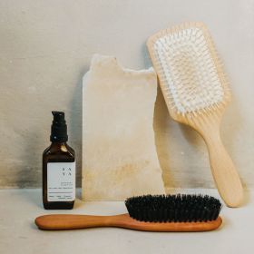 Front view of the beech wood paddle hairbrush with wooden pins.  