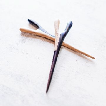 The taro hair stick in tamarind and rosewood aerial view on a table